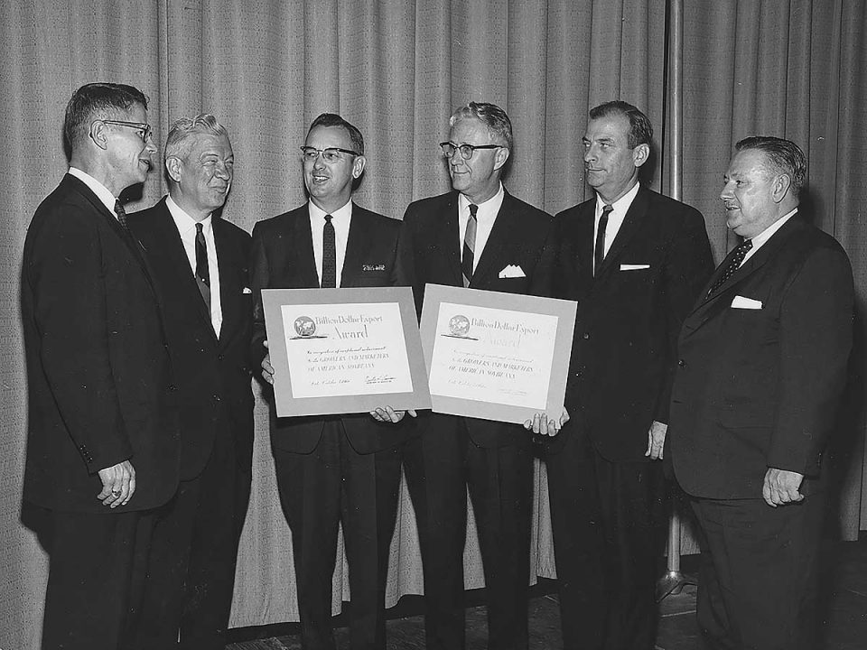 U.S. Secretary of Agriculture Orville Freeman presents “Billion Dollar” export awards to the American Soybean Association and Soybean Council of America in 1966. In the photo from the left are Secretary Freeman; George Strayer, ASA executive vice president, Laurel Meade, ASA president; Glen Pogeler, Soybean Council of America president; and Ray Fiedler and A. H. Becker, Soybean Council of America.