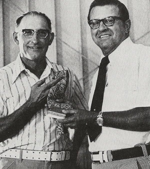Vince Drendel (left), Evansville, president of the new Wisconsin Soybean Association in 1973, receives a complimentary gift and welcome into ASA from President Harold Kuehn.